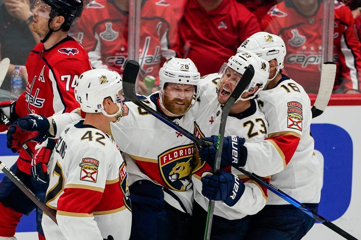 Florida Panthers defenseman Gustav Forsling, right wing Claude Giroux, center Carter Verhaeghe and center Aleksander Barkov, from left, celebrate Giroux’s goal against the Washington Capitals during the third period of Game 6 of a first-round NHL hockey Stanley Cup playoff series Friday, May 13, 2022, in Washington. (AP Photo/Alex Brandon)