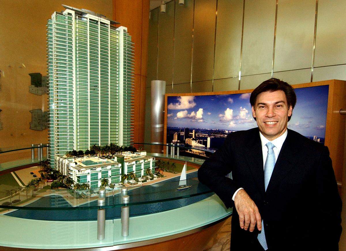 In this photo from 2004, developer Edgardo Defortuna poses in front of a model of the Jade at Brickell condo tower.