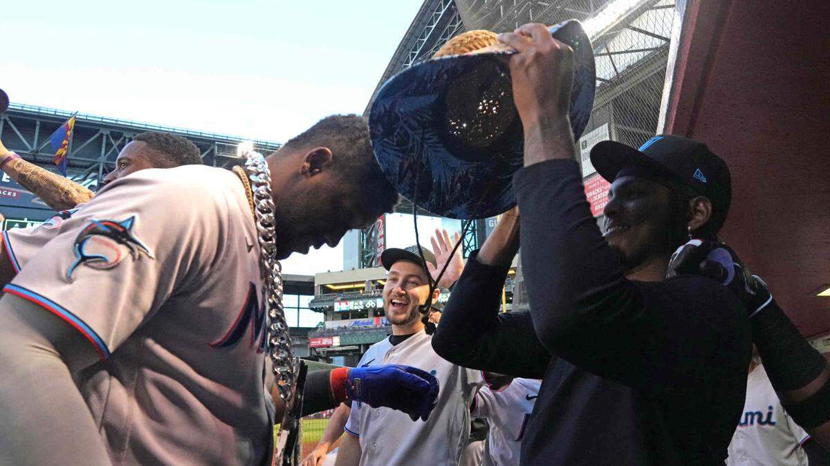 Miami Marlins designated hitter Jorge Soler (12) celebrates with teammates after hitting a three run home run against the Arizona Diamondbacks during the first inning at Chase Field on Tuesday, May 9, 2023.