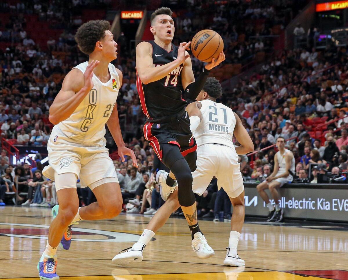 Miami Heat guard Tyler Herro (14) gets inside as Oklahoma City Thunder forward Isaiah Roby (22) defends in the first half at FTX Arena in Miami on Friday, March 18, 2022.
