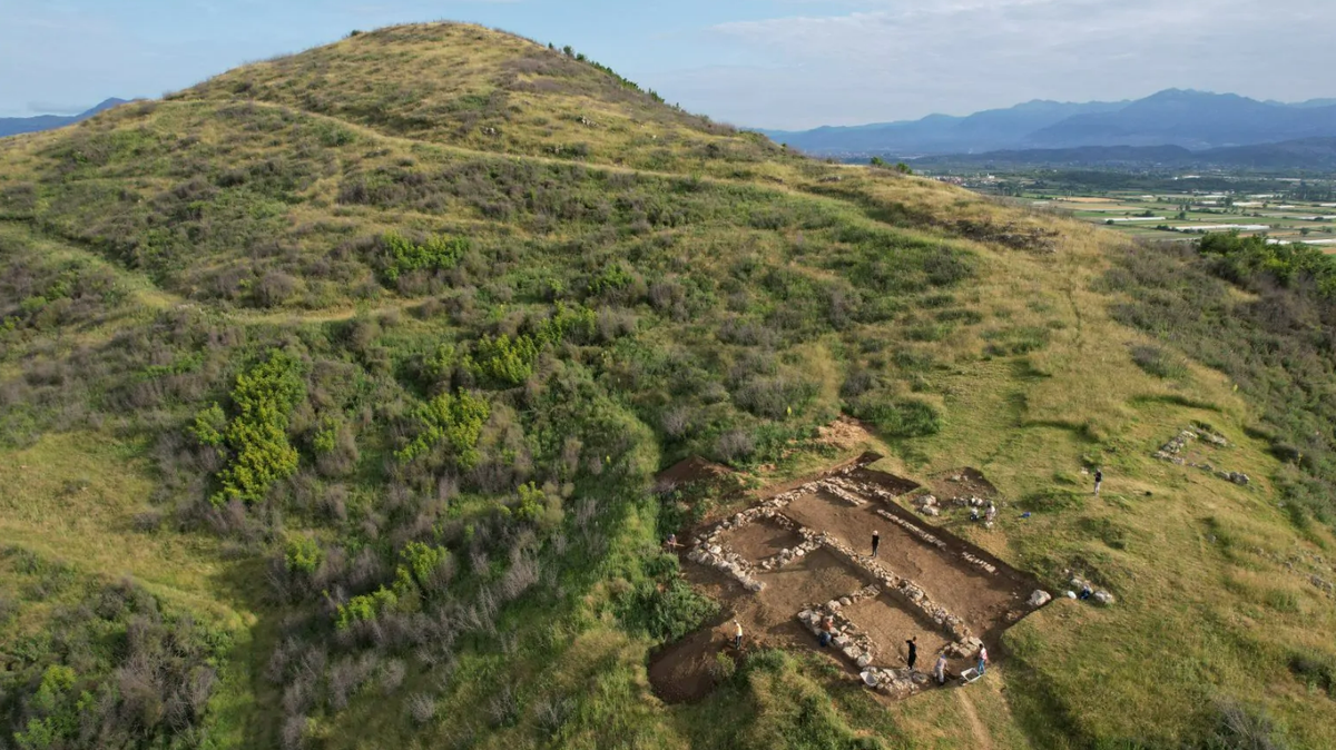 Archaeologists excavated a 2,400-year-old city in Bushati and found a ruined building with an “astonishing” number of wine glasses, photos show.
