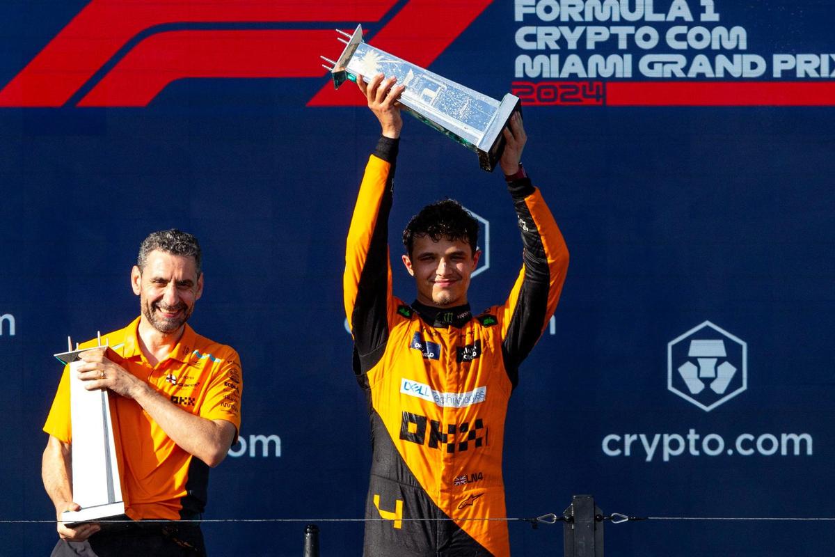 McLaren Principal Andrea Stella, left, and McLaren driver Lando Norris of Britain, right, who placed first, celebrate on the podium after competing in the Formula One Miami Grand Prix.