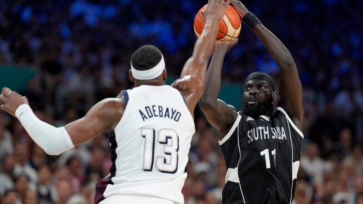 South Sudan point guard Marial Shayok (11) shoots against United States center Bam Adebayo (13) in the second quarter during the Paris 2024 Olympic Summer Games at Stade Pierre-Mauroy.