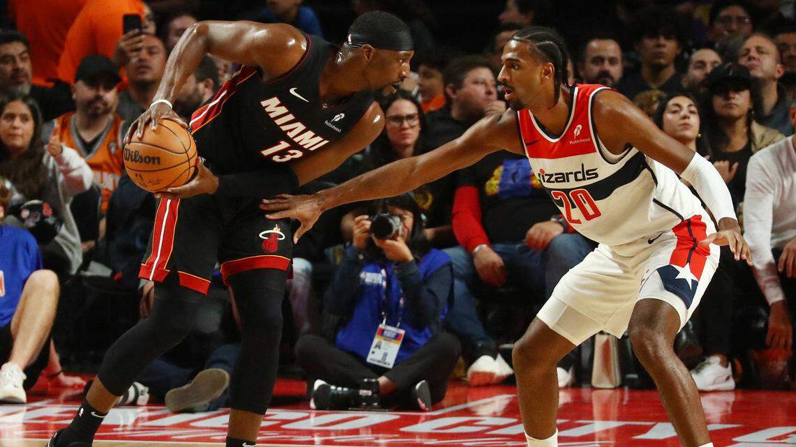 Washington Wizards player Alexandre Sarr in action against Miami Heat player Bam Adebayo during a NBA basketball game at Arena CDMX.