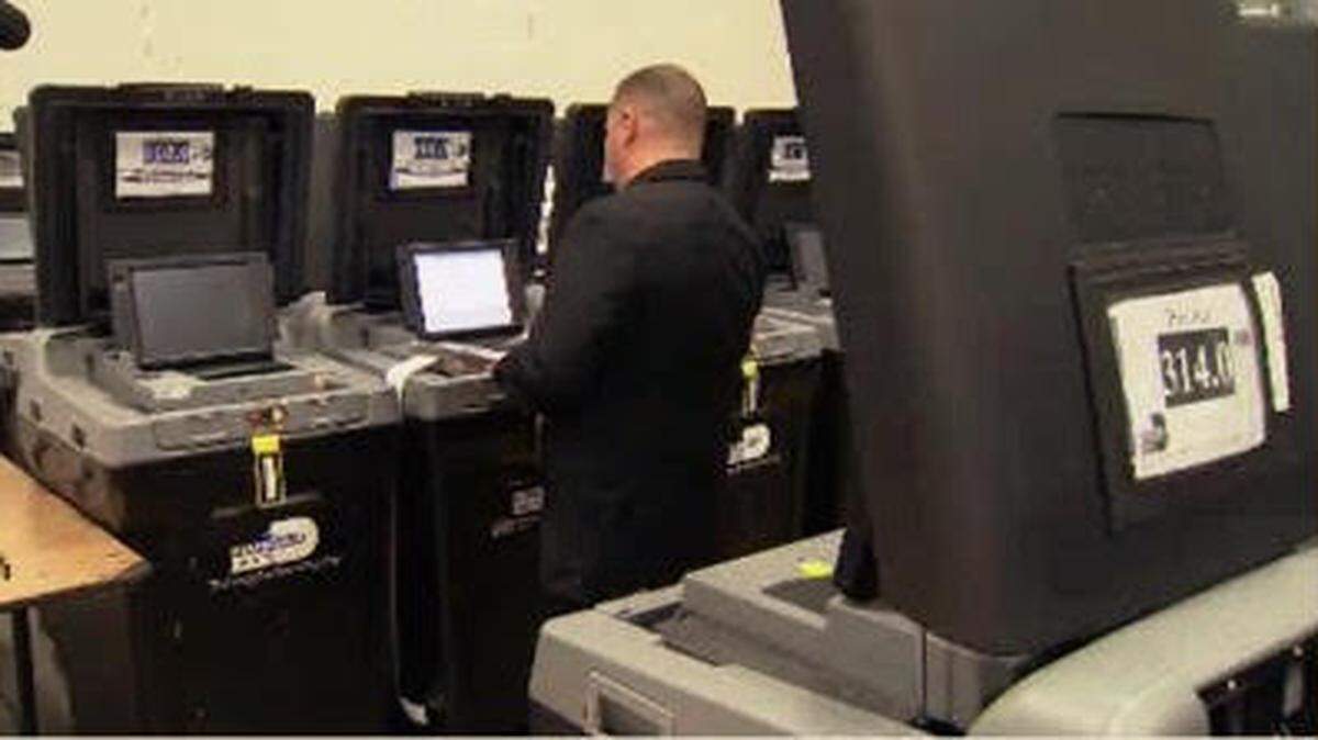 A Miami-Dade County election official tests voting machines in 2016.