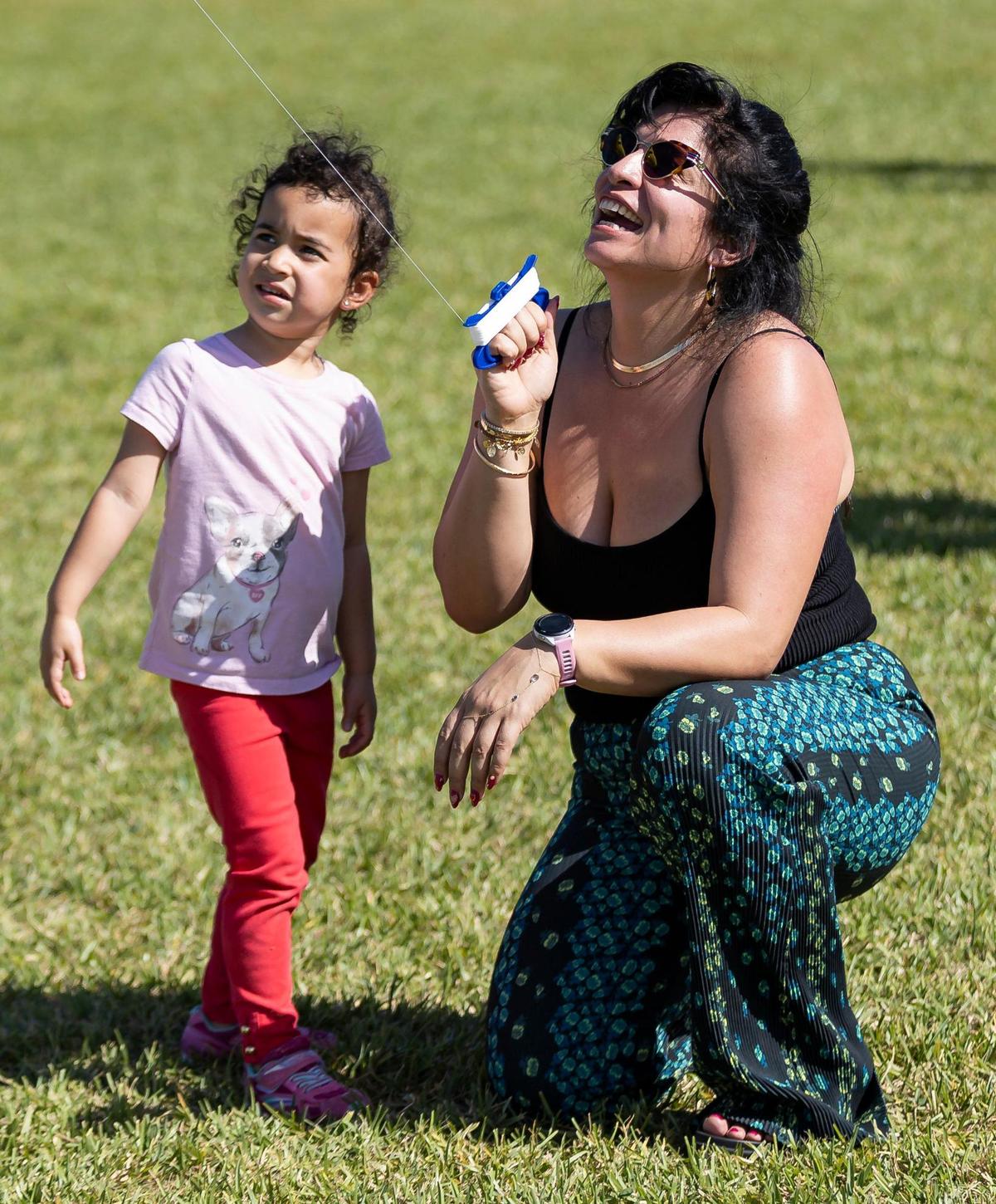 Milay Rodriguez and her niece, Zoey Santiago, 3, fly a kite during the 33rd Annual Kite Festival in Northeast Miami-Dade on Saturday, Feb. 15, 2025.