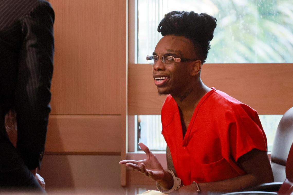 Jamell Demons, better known as rapper YNW Melly speaks with his attorneys during a bond hearing before Broward Circuit Judge John Murphy on Friday, September 15, 2023. His previous trial ended in a mistrial after the jury was deadlocked and unable to reach a verdict in July 2023. Demons, 24, is accused of killing two fellow rappers and conspiring to make it look like a drive-by shooting in October 2018. (Mike Stocker/South Florida Sun Sentinel)