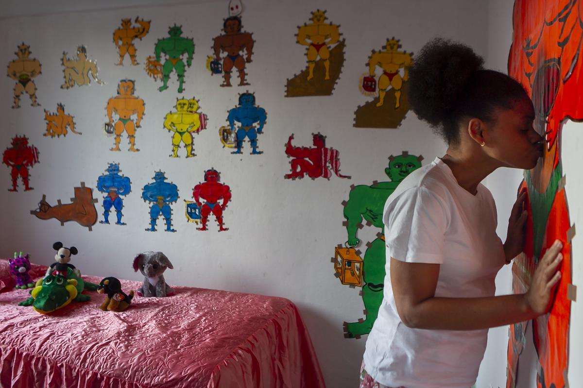 Misleidys Castillo, a Cuban outsider artist who lives in Alamar, creates muscular masculine figures. Some of her favorites are displayed in the wall of her bedroom.