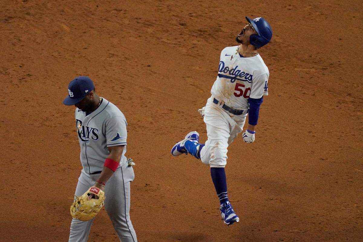 Los Angeles Dodgers’ Mookie Betts celebrates after a home run against the Tampa Bay Rays during the eighth inning in Game 6 of the baseball World Series Tuesday, Oct. 27, 2020, in Arlington, Texas. (AP Photo/Sue Ogrocki)