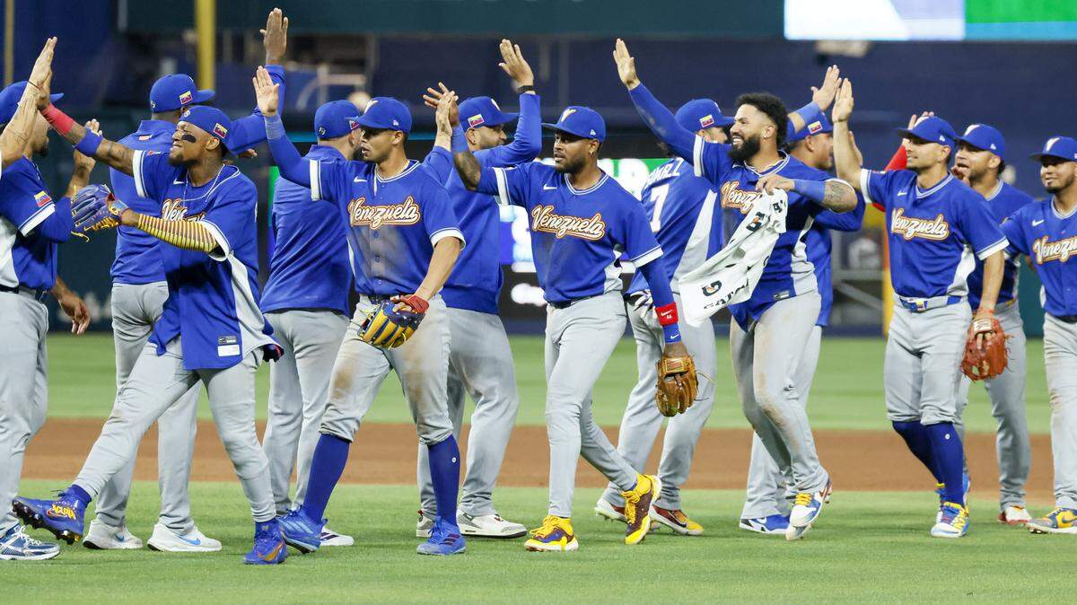 The Venezuela team celebrates after defeating Japan at the World Baseball Classic quarter finals at loanDepot park on Saturday, March 14, 2026.