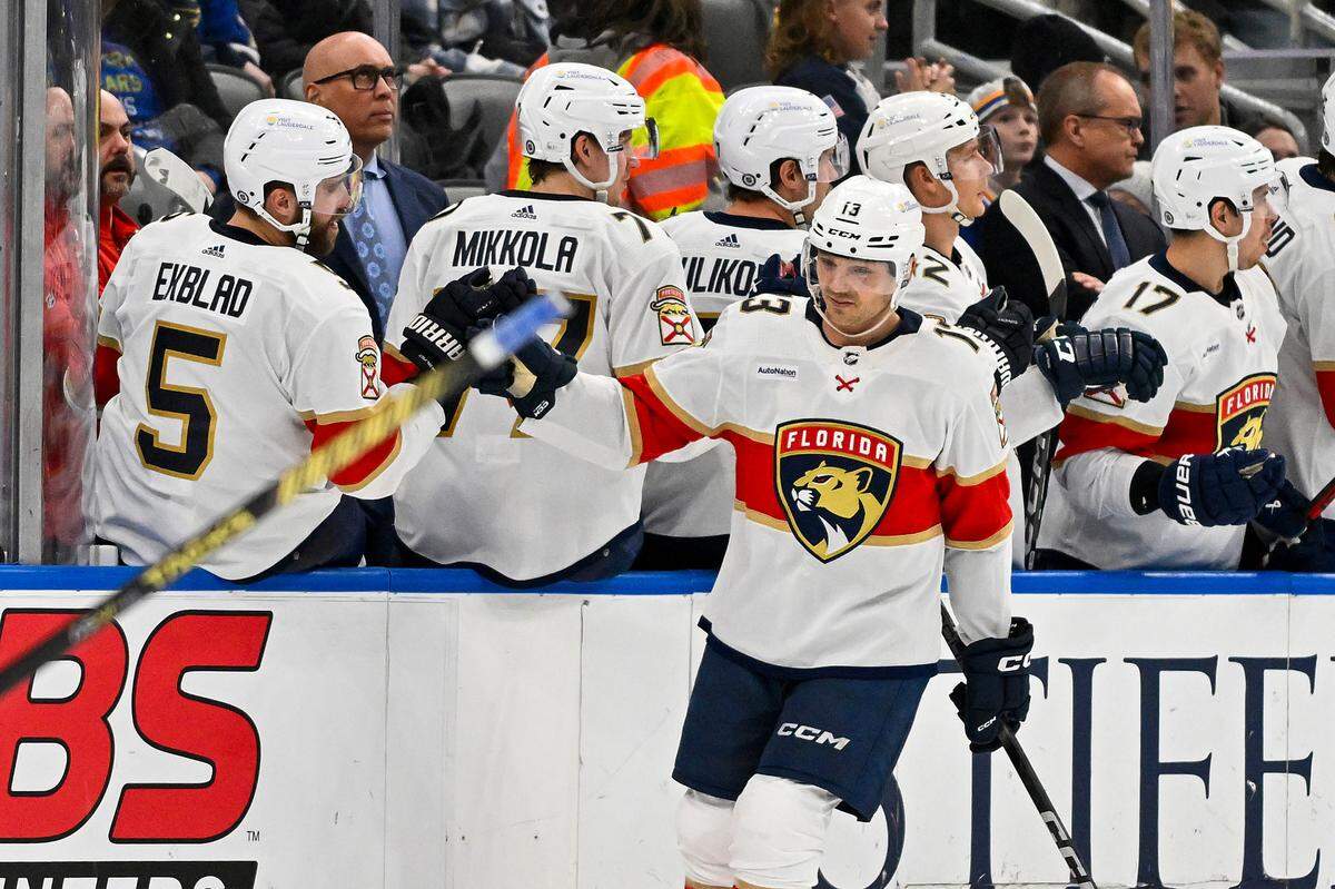 Jan 9, 2024; St. Louis, Missouri, USA; Florida Panthers center Sam Reinhart (13) is congratulated by defenseman Aaron Ekblad (5) after scoring against the St. Louis Blues during the second period at Enterprise Center. Mandatory Credit: Jeff Curry-USA TODAY Sports
