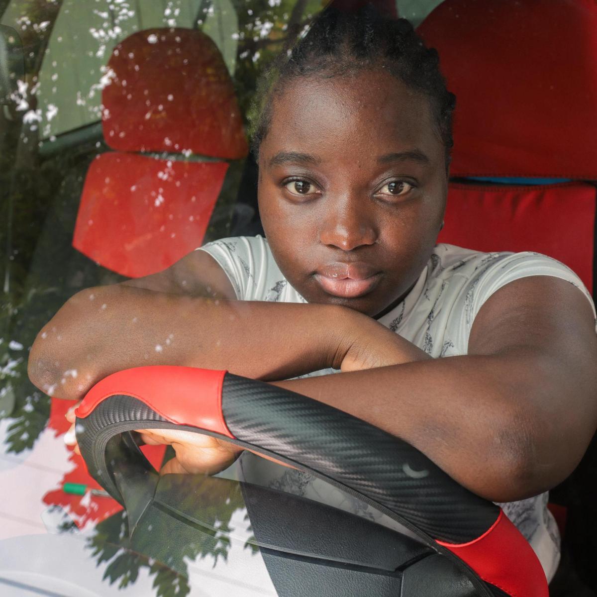 Meloveda Victor, 20, sits in her car at Casa Valentina housing where she has lived for the past several years.