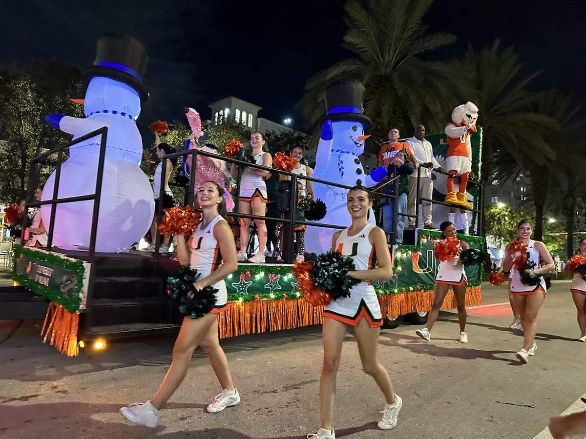 University of Miami cheerleaders and Sebastian the Ibis (doing double duty as the UM’s mascot rode in a convertible just an hour or so earlier on the Miracle Mile parade route of the 75th Annual Junior Orange Bowl Parade in Coral Gables on Dec. 10, 2023.