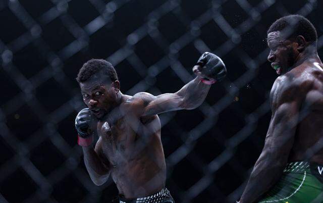 Kevin Holland of the United States and Randy Brown of Jamaica fight in their welterweight bout at UFC 327 at the Kaseya Center on Saturday, April 11, 2026, in downtown Miami, Fla.