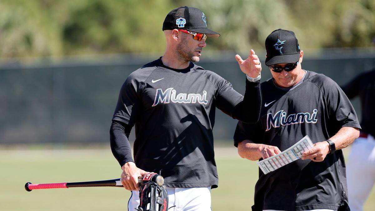 Miami Marlins manager Skip Schumaker (left) and infield coach Jody Reed talk during spring training at Roger Dean Chevrolet Stadium in Jupiter, Florida on Tuesday, February 21, 2023.