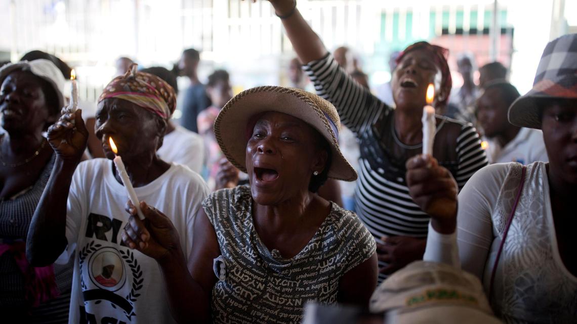 Miliana Louis cries during a Dec. 13, 2018, memorial for the victims of a massacre in the La Saline slum of Port-au-Prince, Haiti. Louis said her 22-year-old son, James, was killed with a machete in the mass killing on Nov. 13, and his body fed to pigs.