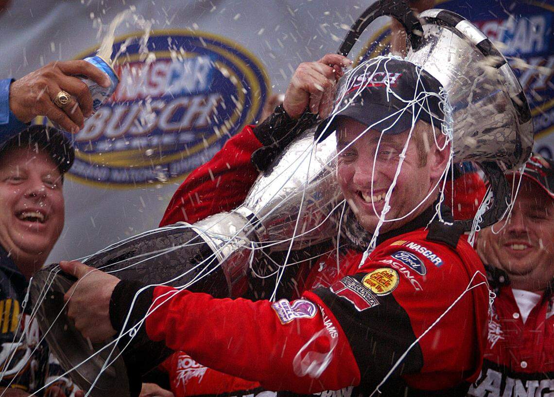 Grainger Ford team driver&nbsp;Greg&nbsp;Biffle&nbsp;is showered with beer and confetti at the Homestead-Miami Speedway in 2002.