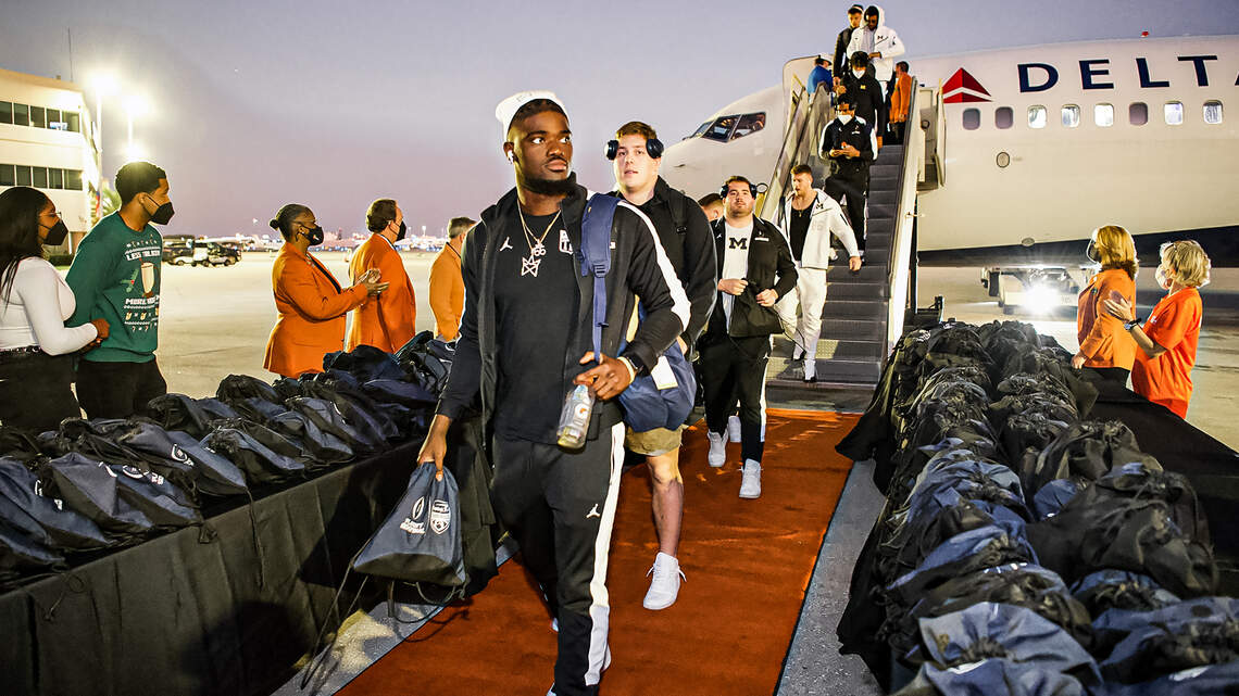 Amid playoff stakes and COVID-19, Orange Bowl is a business trip for Georgia, Michigan