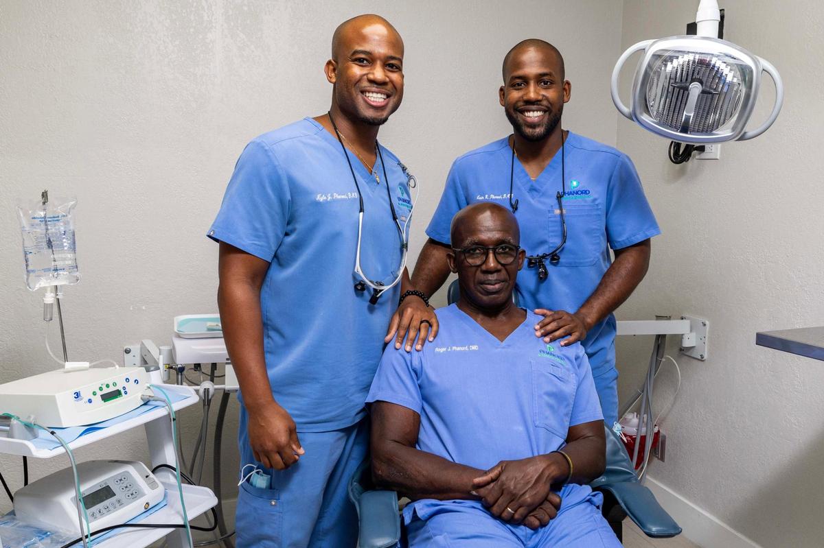 Father and sons trio Dr. Roger, Dr. Kevin and Dr. Kyle Phanord strike a pose at the offices of Phanord & Associates, P.A. Mall on Monday, June 9, 2025, in North Miami, Fla.