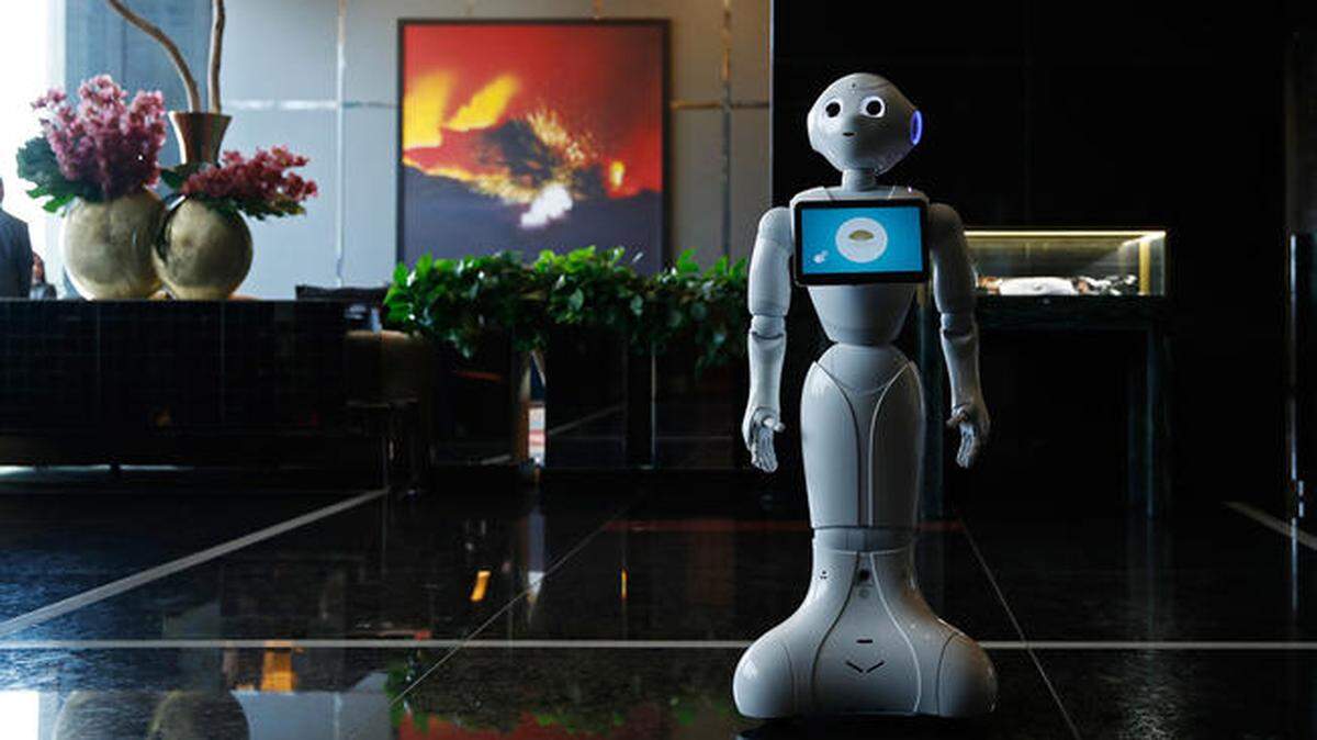A robot named Pepper stands in the lobby of the Mandarin Oriental in Las Vegas. Pepper is programmed to interact with guests and answer pre-programmed questions.