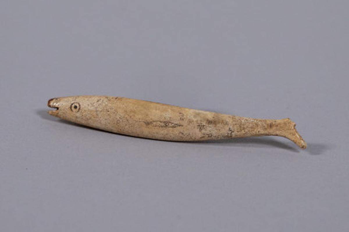 The antique fish toy.