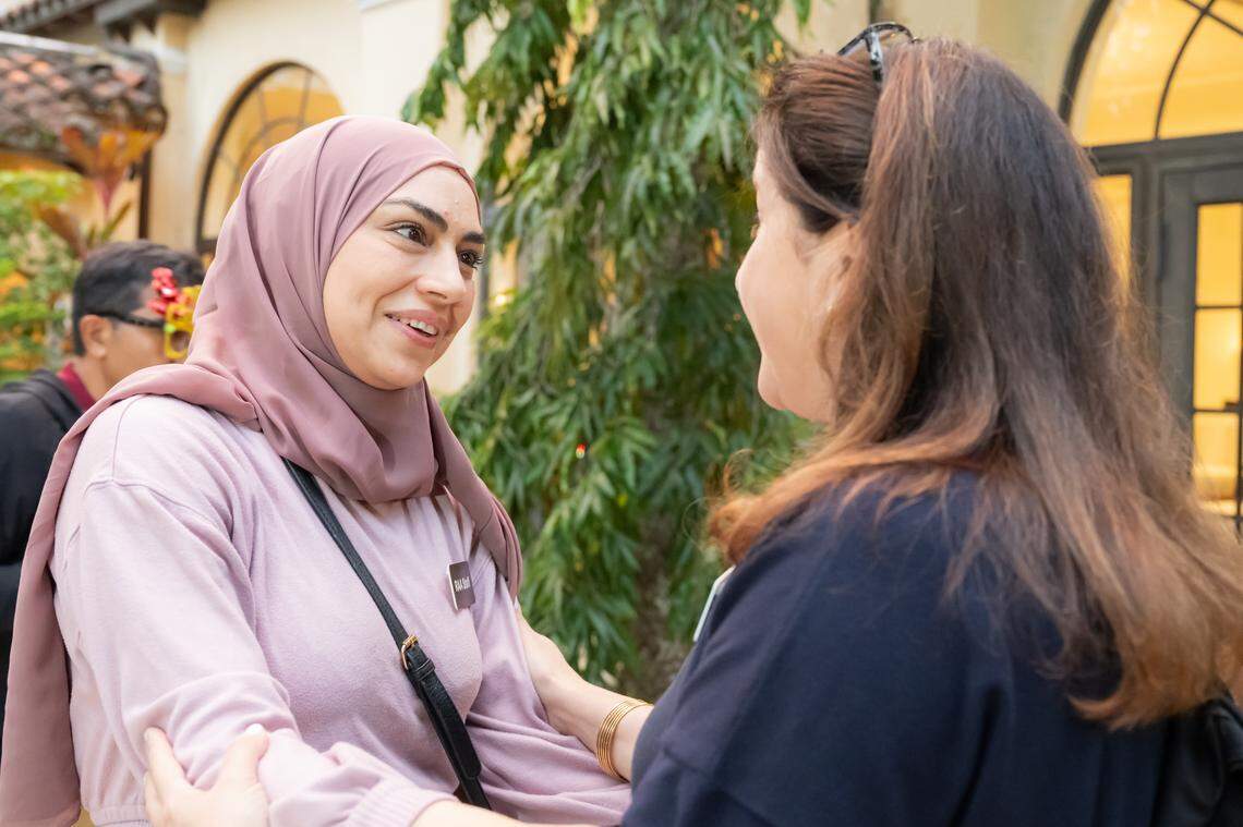 A Refugee Assistance Alliance staff member with a volunteer