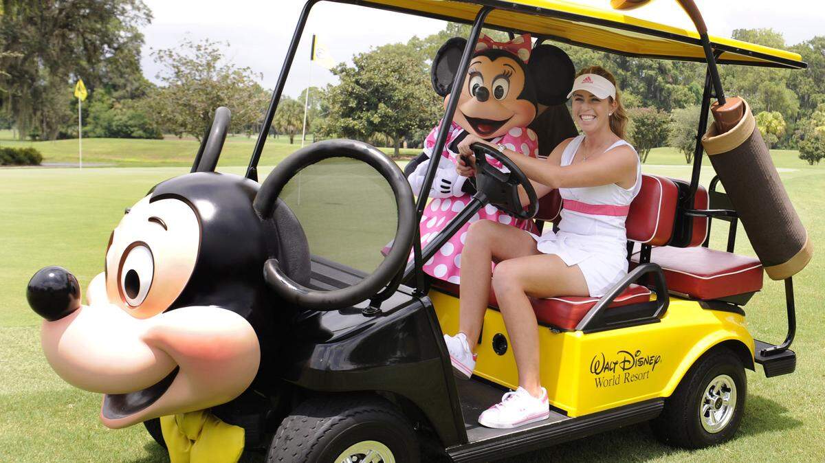 In this 2010 file photo,  LPGA golfer Paula Creamer drives Minnie Mouse to the putting green in a custom Mickey Mouse golf cart at Disney’s Magnolia Golf Course in Lake Buena Vista.