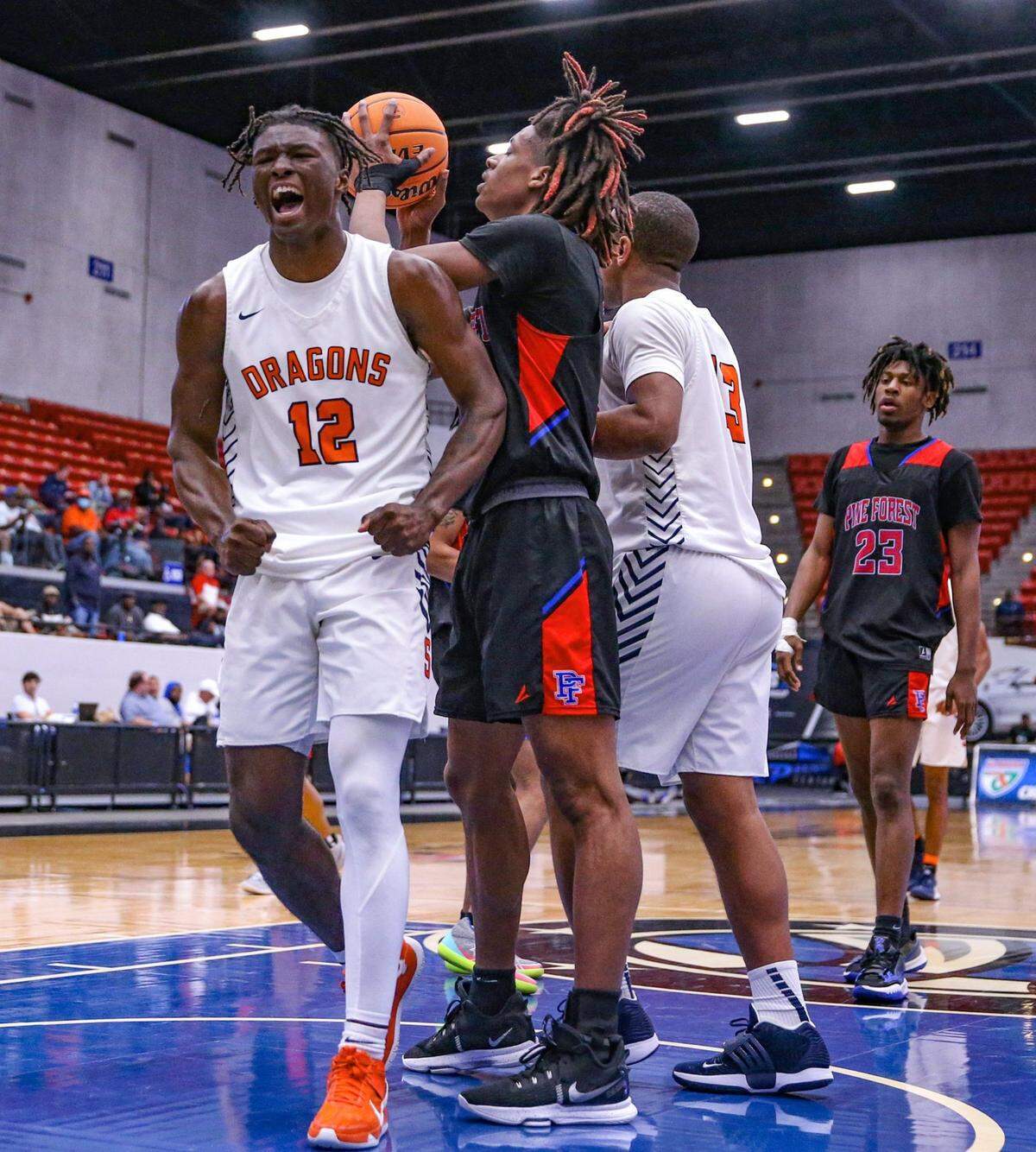 Stranahan&nbsp;High Schools forward Hykeem Williams (12) reacts after scoring against Pine Forest in Class 5A boys basketball semifinal at the RP Funding Center in Lakeland on Thursday, March 3, 2022.