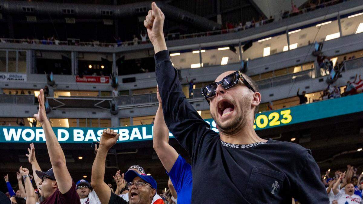Fans react from the stands during the seventh inning of a 2023 World Baseball Classic pool D game against between Venezuela and Puerto Rico at loanDepot Park in Miami, Florida, on Sunday, March 12, 2023.