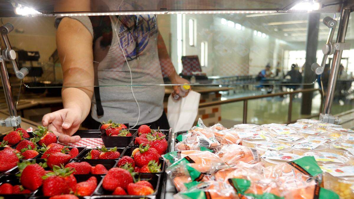 Healthy fruits and vegetables such as fresh carrots are being served more with school lunches to make sure children get healthy breakfasts and lunches during the school day.