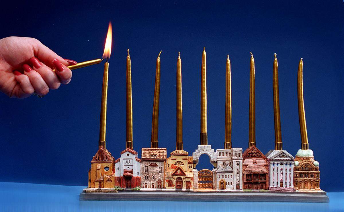 Lighting the menorah is the focus of Hanukkah.