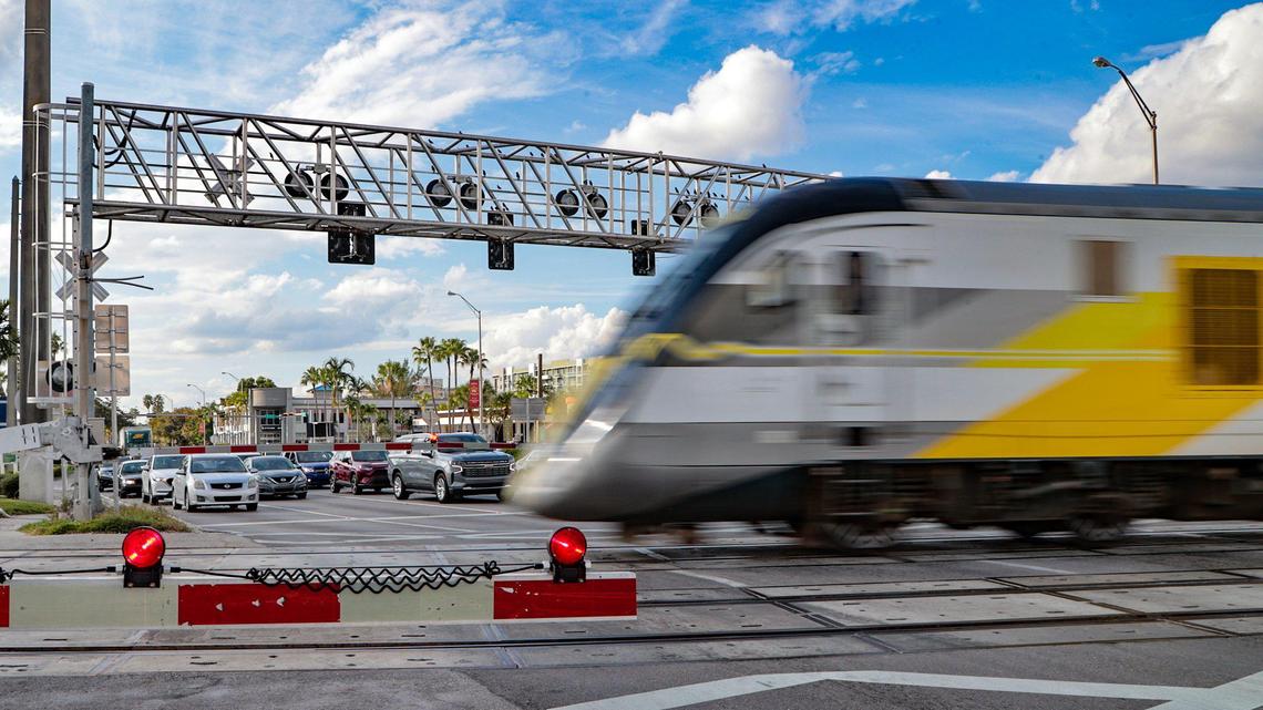 A Brightline train crosses the intersection at Northeast 163rd Street and U.S. 1 in North Miami Beach.