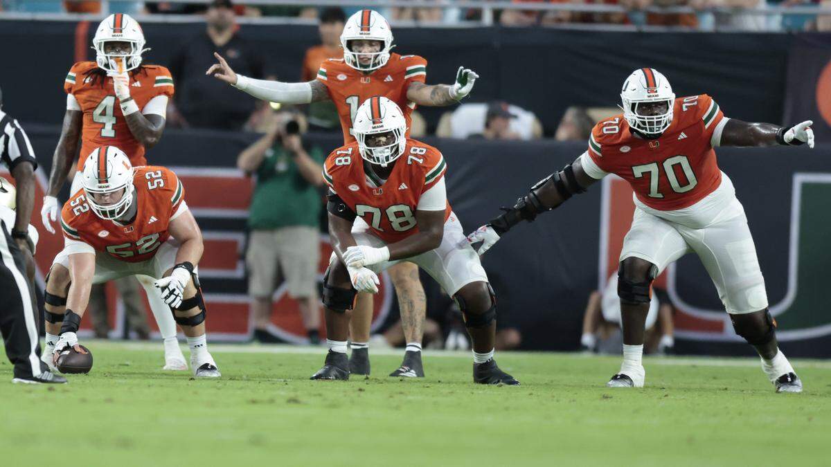 Miami Hurricanes offensive lineman James Brockermeyer (52), Matt McCoy (78) and Markel Bell(70) during their of their NCAA football game against the USF Bulls at Hard Rock Stadium in Miami Gardens, Florida, on Saturday, September 13, 2025.