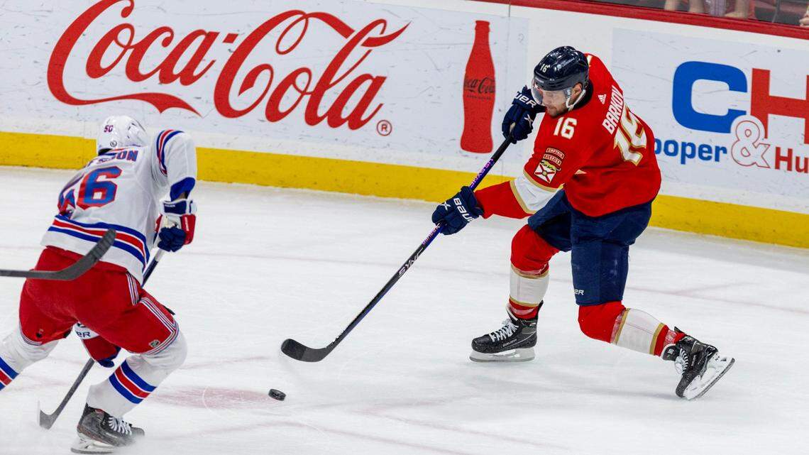 Florida Panthers forward Aleksander Barkov (16) shoots the puck past New York Rangers defenseman Erik Gustafsson (56) during the first period of an NHL game at Amerant Bank Arena in Sunrise, Florida, on Friday, December 29, 2023.