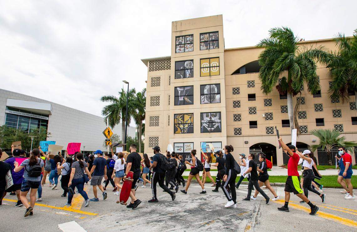 Protesters march through the Florida International University main campus in honor of George Floyd during a protest for Black Lives Matter in Miami, Florida on Saturday, June 6, 2020.