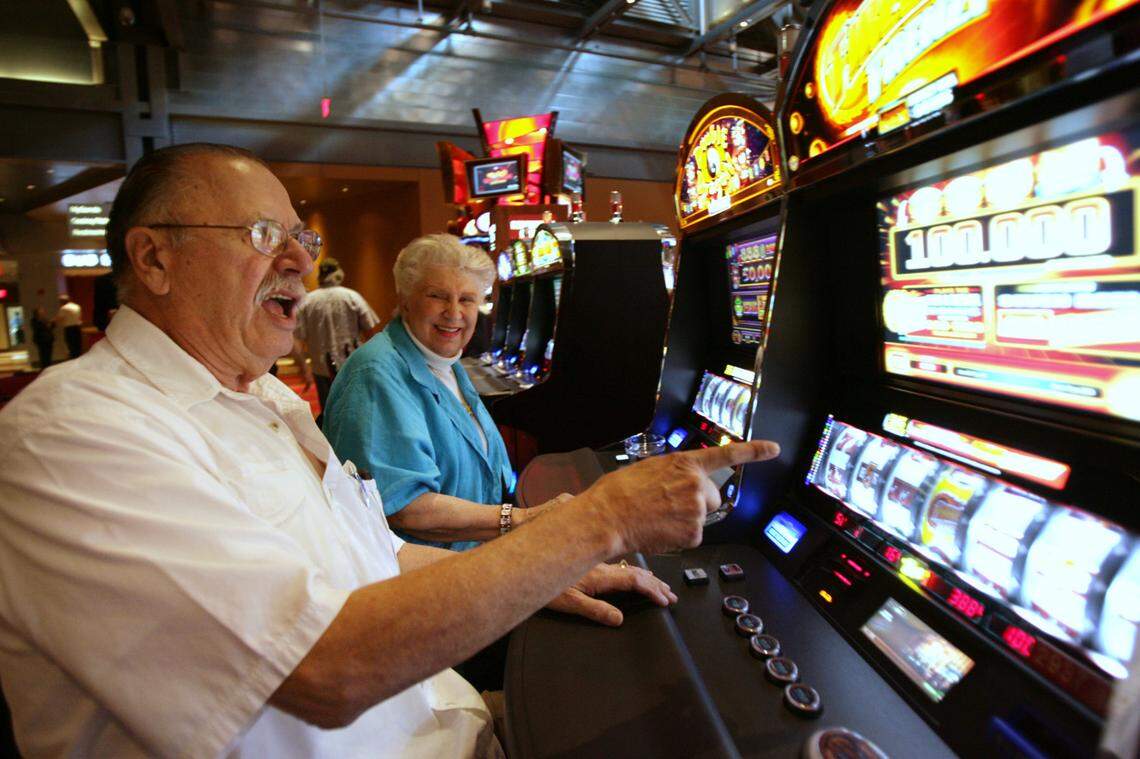 In this May 22, 2009, file photo, Vito Valentinetti reacts with his wife, Mary Ann, after a win while playing a slot machine at the Sands Casino Bethlehem in Bethlehem, Pennsylvania. Sands sold that casino to the Poarch Band of Creek Indians of Alabama and North Florida in 2019.