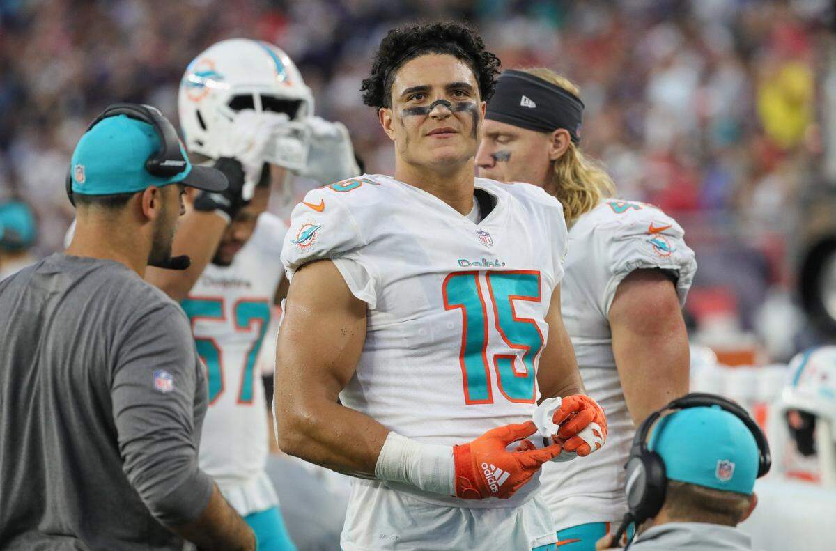 Miami Dolphins linebacker Jaelan Phillips (15) looks on as the Dolphins lead in the fourth quarter against the New England Patriots at Gillette Stadium in Foxborough, Massachusetts on Sunday, September 12, 2021.