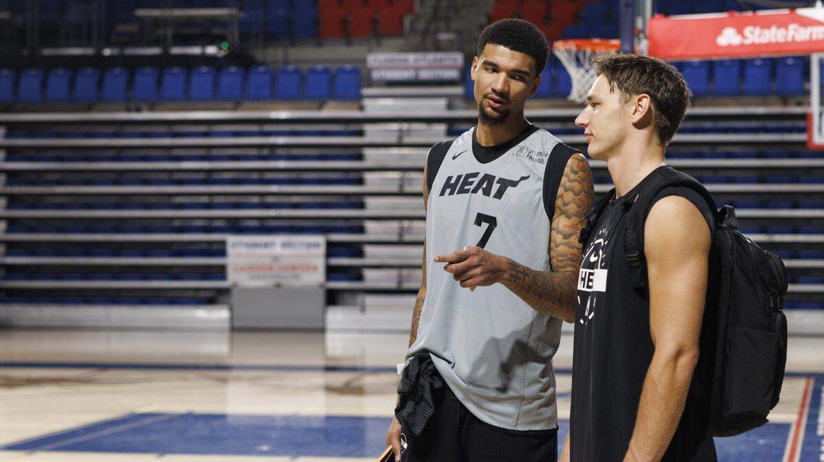 Kel'el Ware (7) talks to Pelle Larsson (9) during the first day of Miami Heat Training Camp on Sept. 30, 2025, at Florida Atlantic University in Boca Raton.