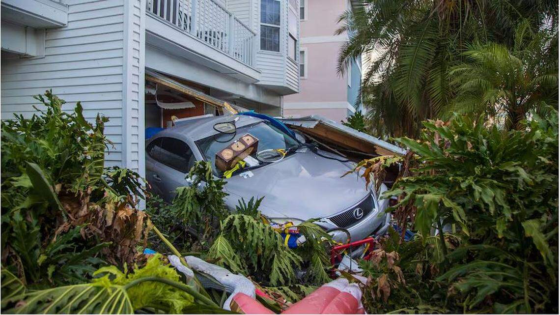 A vehicle was pushed out of its garage caused by storm surge from Hurricane Helene on Saturday, Sept. 28, 2024 in Madeira Beach.