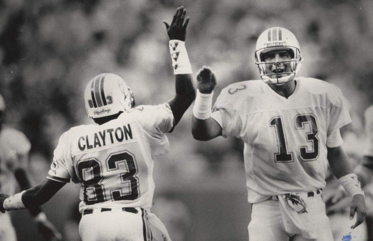 Mark Clayton and Dan Marino congratulate each other after Marino threw long touchdown pass to Calyton to put Dolphins ahead for good.