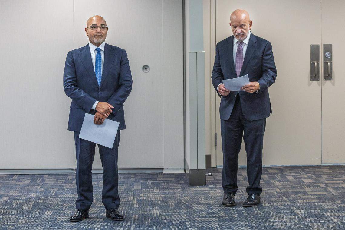 Jackson Health System’s CEO Carlos Migoya (right) and his successor David Zambrana, Jackson’s president and chief operating officer, wait for their turn to speak during a press conference where Migoya announced he is stepping down after more than a decade of leading one of the largest public health systems in the nation, on Thursday, Jan. 29, 2026.