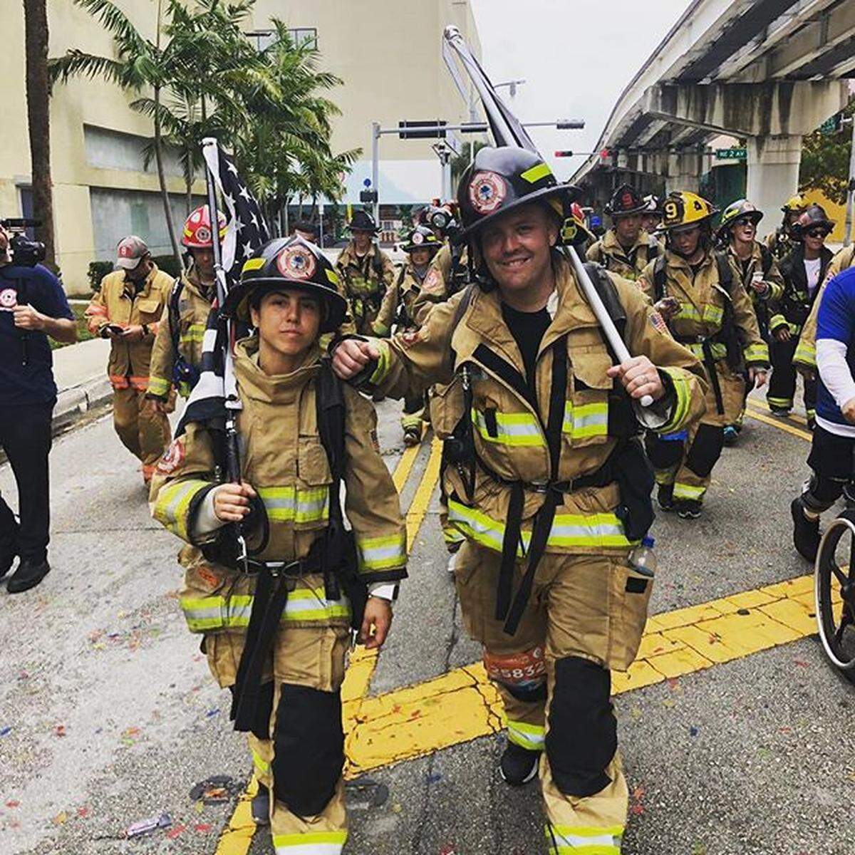 Firefighters participate in the 2019 Miami Half Marathon, joining the Never Walk Alone campaign to raise awareness of PTSD among first responders.