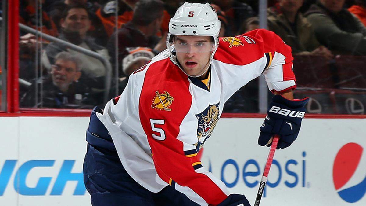 Aaron Ekblad #5 of the Florida Panthers looks to pass in the first period against the Philadelphia Flyers on December 18, 2014 at the Wells Fargo Center in Philadelphia, Pennsylvania. 