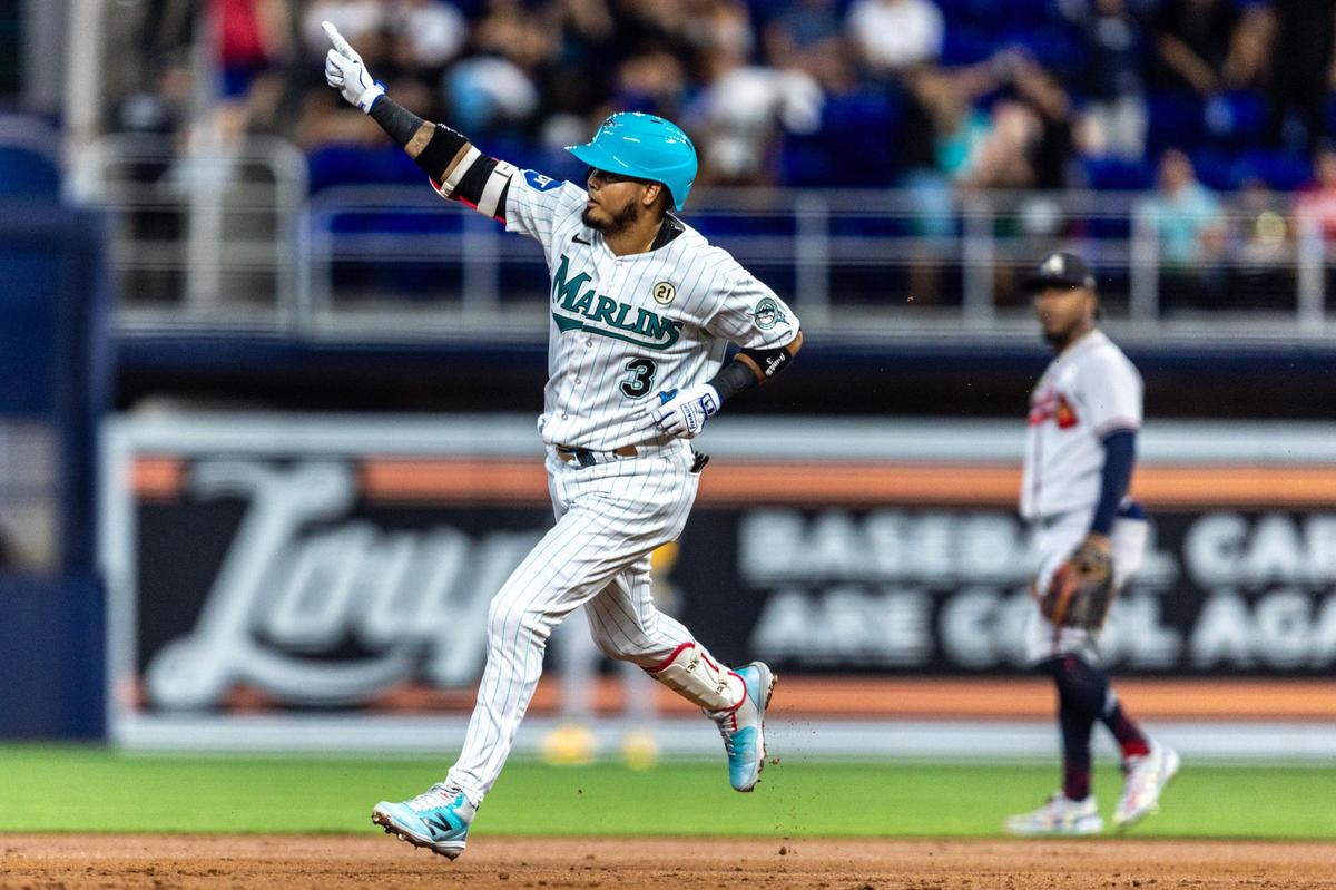 Miami Marlins base runner Luis Arraez (3) reacts to homering as he rounds the bases during the first inning of an MLB game against the Atlanta Braves at loanDepot park in the Little Havana neighborhood of Miami, Florida, on Friday, September 15, 2023