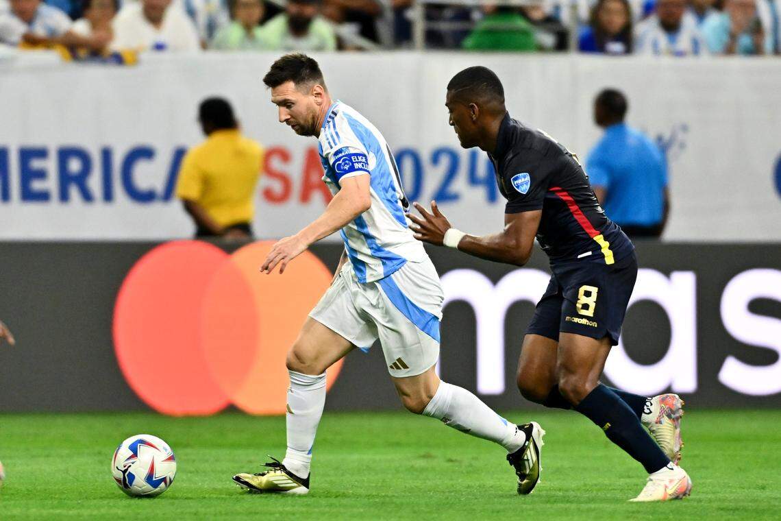 Jul 4, 2024; Houston, TX, USA; Argentina’s striker Lionel Messi (10) controls the ball as Ecuador’s midfielder Carlos Gruezo (8) defends during the first half at NRG Stadium. Mandatory Credit: Maria Lysaker-USA TODAY Sports