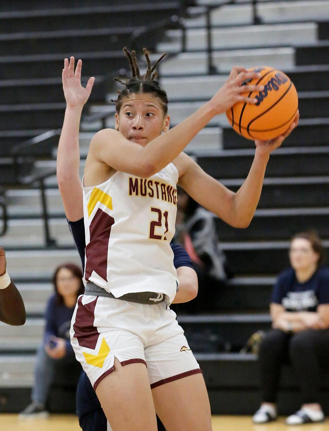 Horeb Christian’s Emely Rodriguez (21) grabs a rebound against Merritt Island Christian during the Region 4-2A girls’ basketball quarterfinal on Thursday, at Miami Lakes Educational Center in Miami Lakes.