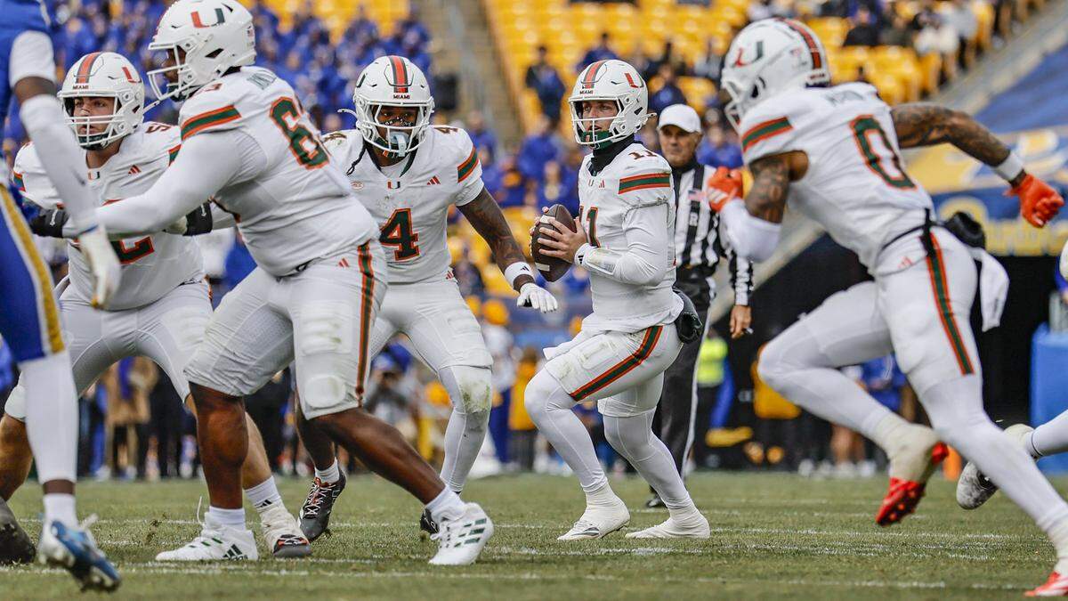 Miami Hurricanes quarterback Carson Beck (11) sets up to pass during an NCAA football game against the Pittsburgh Panthers at Acrisure Stadium in Pittsburgh, PA, on Saturday, November 29, 2025.
