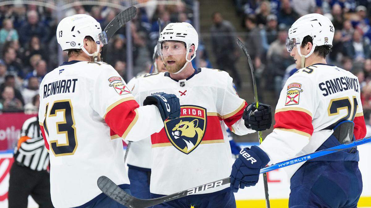 Mar 13, 2025; Toronto, Ontario, CAN; Florida Panthers center Sam Bennett (9) scores a goal and celebrates with center Sam Reinhart (13) against the Toronto Maple Leafs during the second period at Scotiabank Arena.