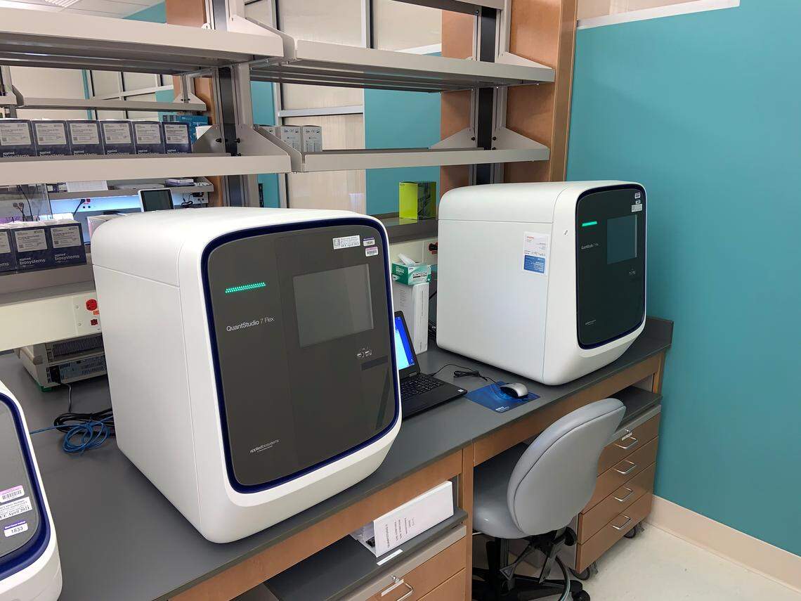 Two machines inside the Baptist Hospital of Miami Molecular Diagnostic Laboratory at Miami Cancer Institute.