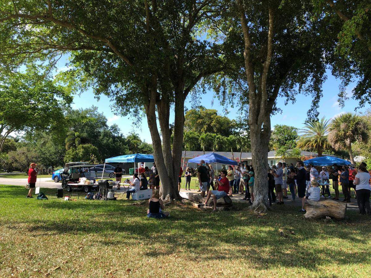 A group of about 80 Palmetto Bay residents gathered for a block party on Southwest 87th Avenue, where the street dead-ends at the site of a proposed bridge in March 2021.
